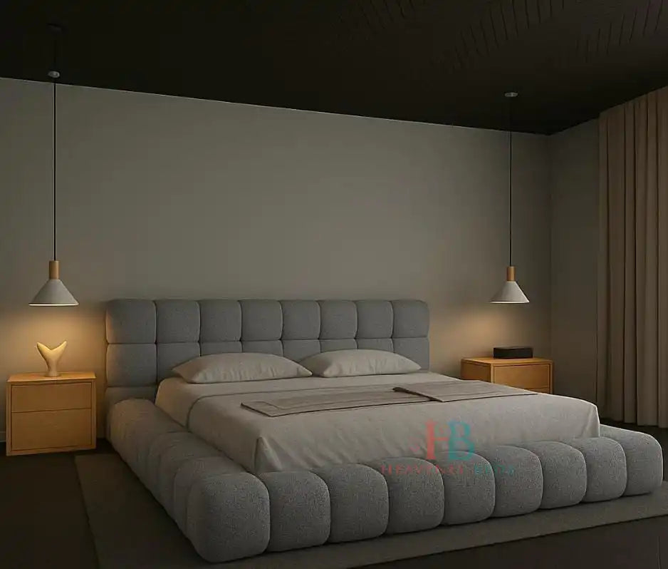 Modern grey teddy fabric bubble bed frame with padded headboard and gas lift storage, styled in a minimal bedroom with wooden nightstands and pendant lighting