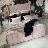 Wingback bed frame in pink plush velvet